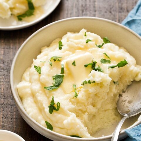 Mashed potatoes in a bowl with a spoon