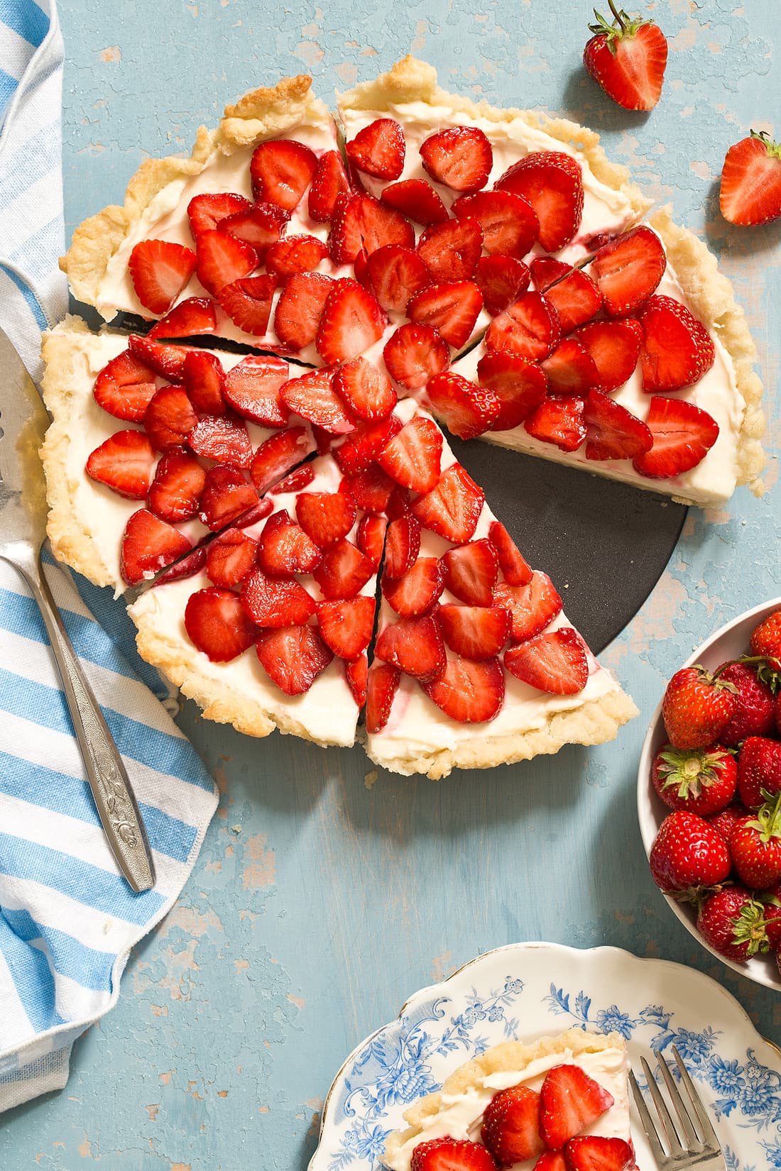 Strawberry Cream Cheese Tart with a homemade pie crust is an easy summer tart that will impress. It's like eating a strawberry pie and cheesecake in one bite.