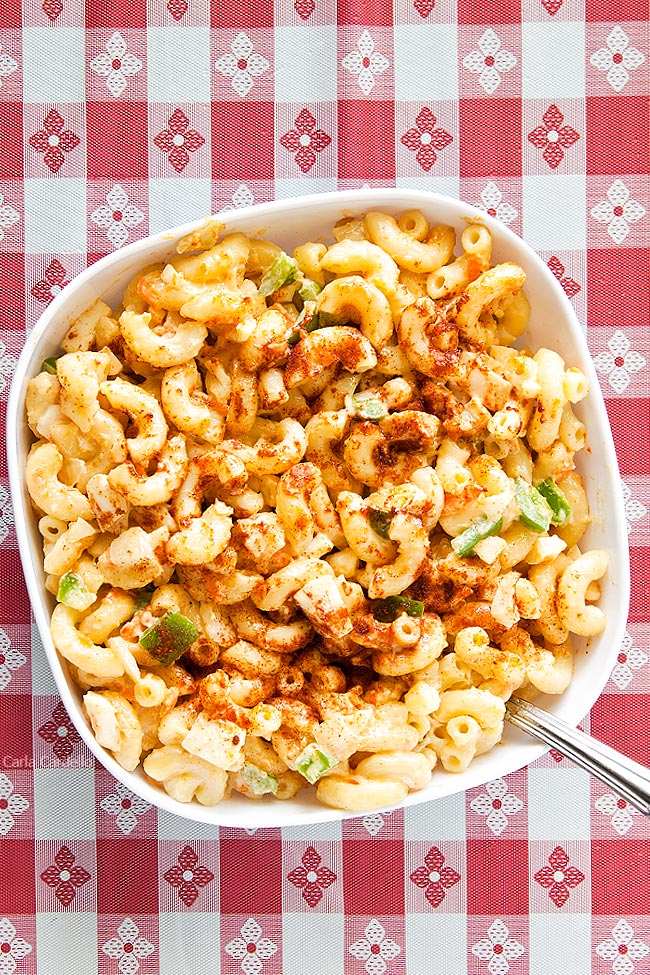 Amish Macaroni Salad in white bowl on red checkered background