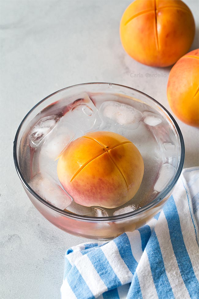 Peach in bowl of ice water