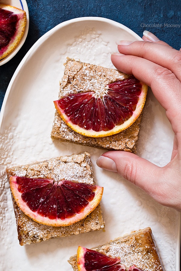Blood Orange Bars are a twist on classic lemon bars with a melt-in-your-mouth buttery crust and a soft jelly-like orange filling. Make them before blood orange season is gone!