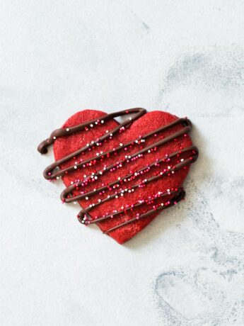One Red Velvet Sugar Cookie with chocolate drizzle