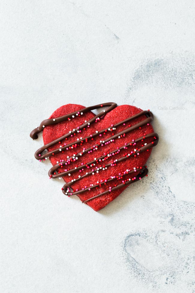 One Red Velvet Sugar Cookie with chocolate drizzle