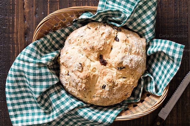 Irish Soda Bread in bread basket with green linen