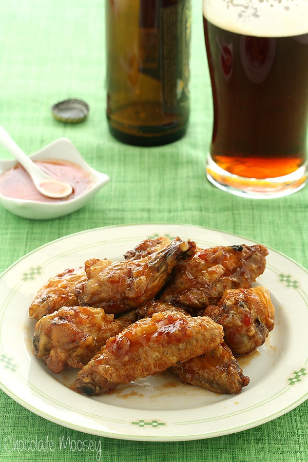 Plate of sweet chili wings on green tablecloth