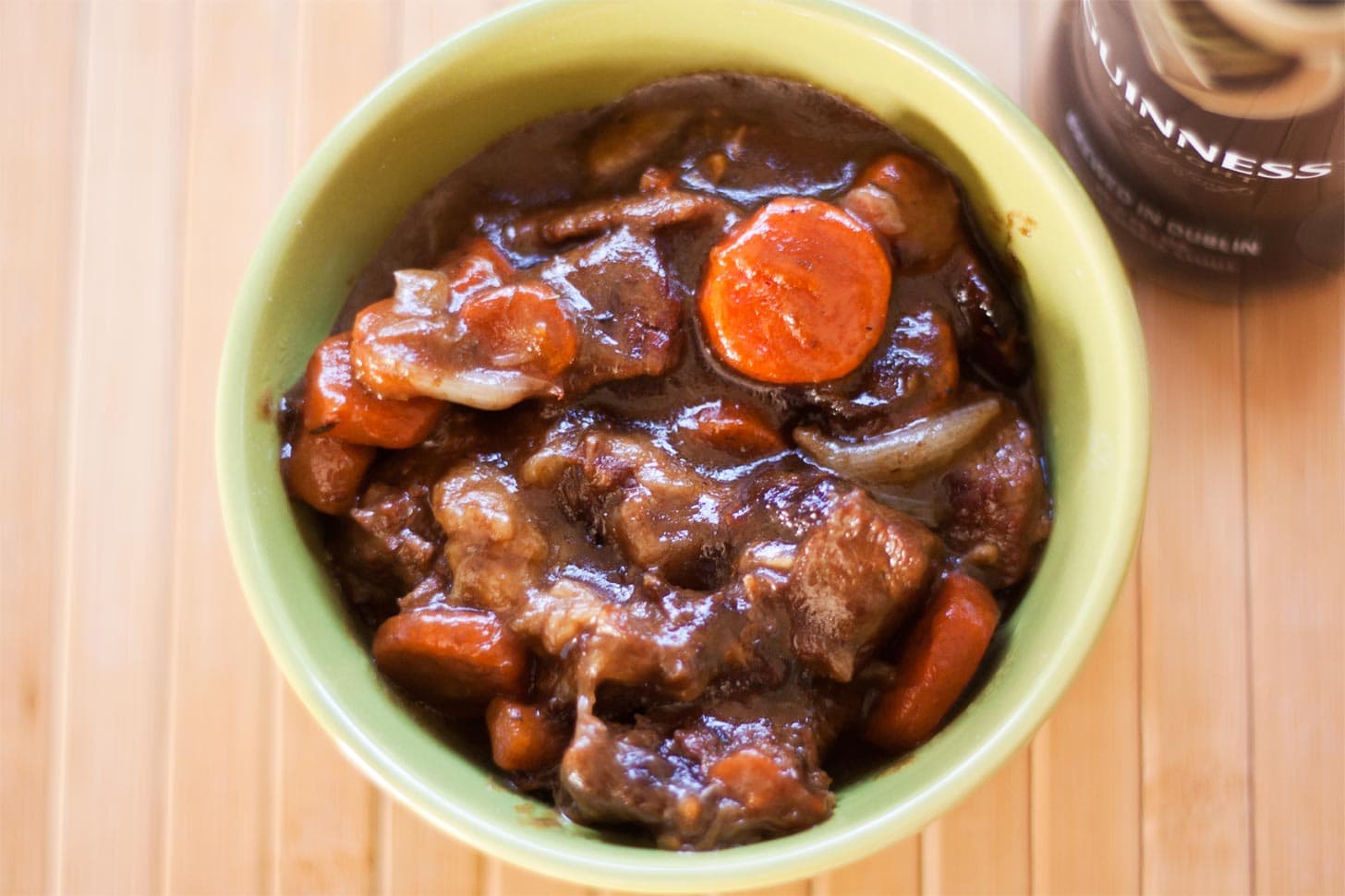 Beef and Guinness stew served in green bowl
