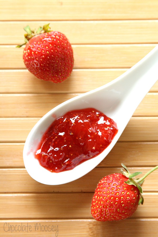 Strawberry jam on a white spoon