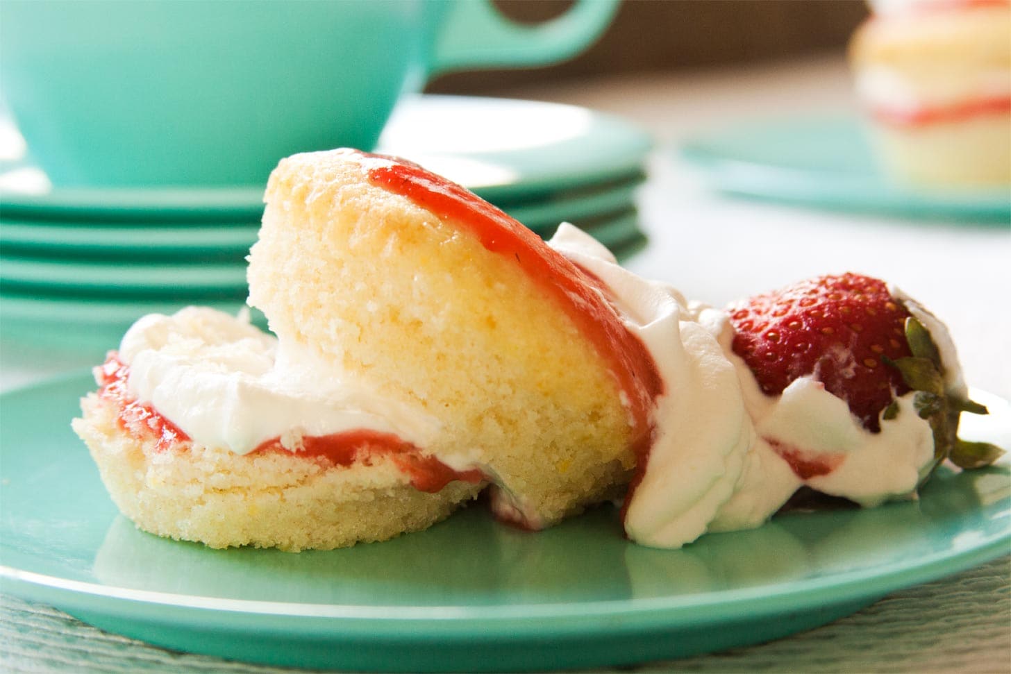 Strawberry Shortcake Cupcakes layered with strawberry curd and whipped cream