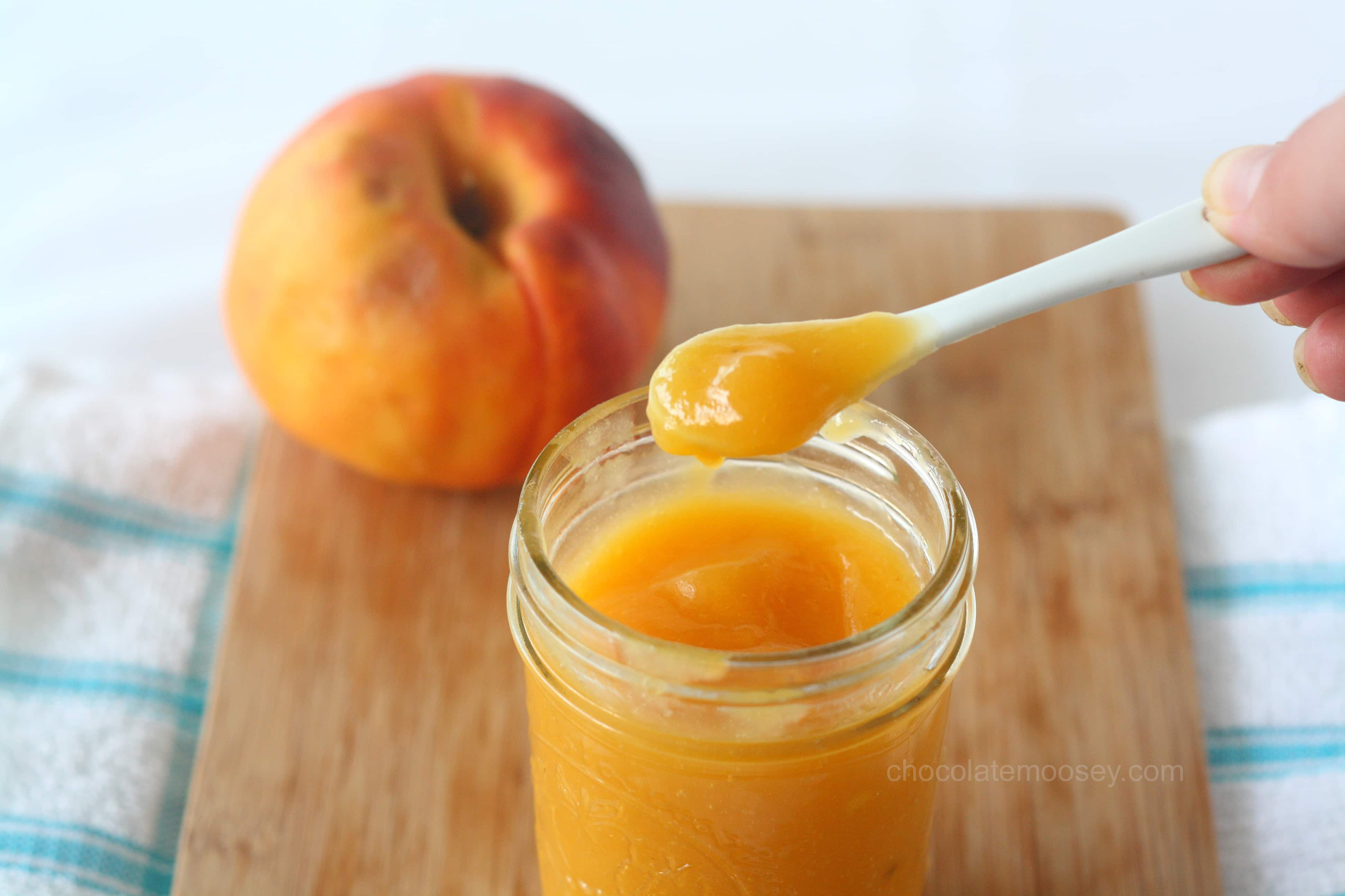 Peach curd on white spoon