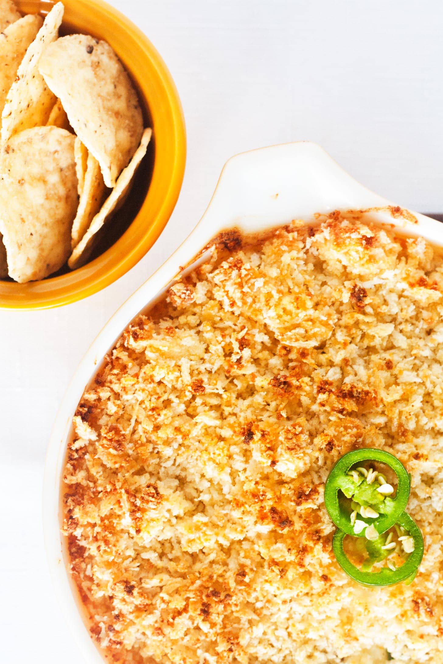 Close up overhead shot of jalapeno popper dip with nachos
