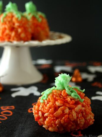 Rice Krispie Pumpkins on black Halloween fabric