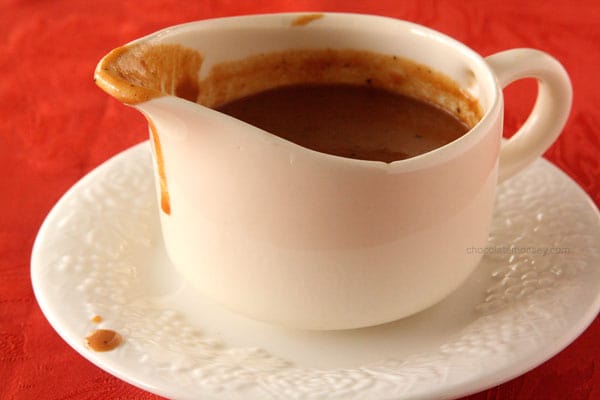 Homemade Gravy Dripping Out Of Gravy Boat