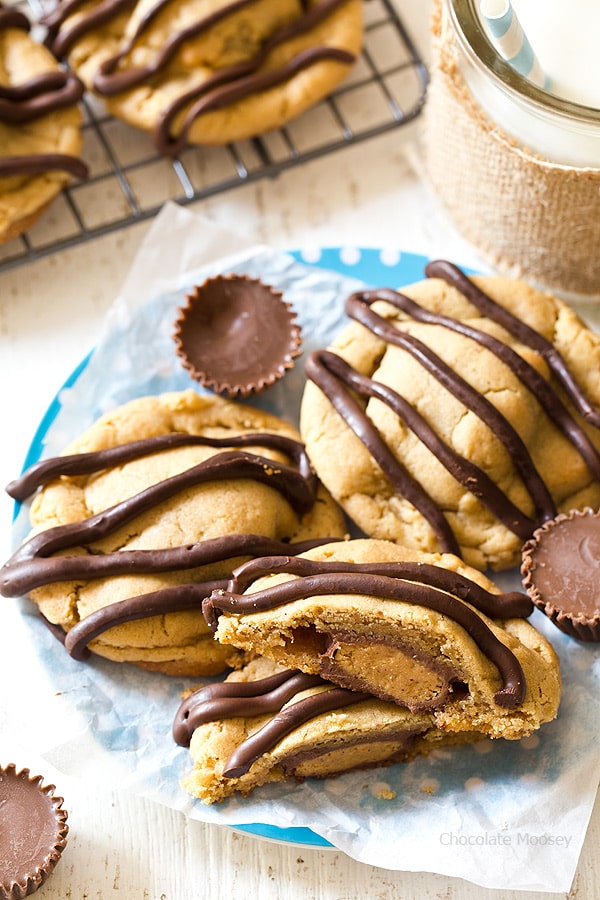 What's better than a single peanut butter cookie? Double Peanut Butter Surprise Cookies stuffed with a peanut butter cup and drizzled with chocolate on top.