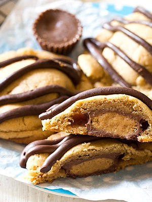 What's better than a single peanut butter cookie? Double Peanut Butter Surprise Cookies stuffed with a peanut butter cup and drizzled with chocolate on top.