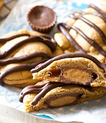 What's better than a single peanut butter cookie? Double Peanut Butter Surprise Cookies stuffed with a peanut butter cup and drizzled with chocolate on top.