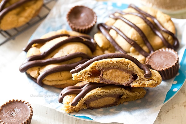 What's better than a single peanut butter cookie? Double Peanut Butter Surprise Cookies stuffed with a peanut butter cup and drizzled with chocolate on top.