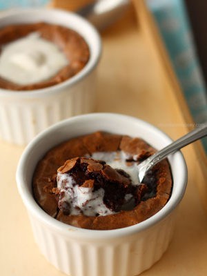 Brownie in white ramekin with spoon in middle