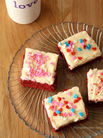 If you love red velvet cake, then you'll love these homemade Small Batch Red Velvet Sugar Cookie Bars from scratch without cake mix, complete with a small batch of cream cheese frosting and sprinkles.