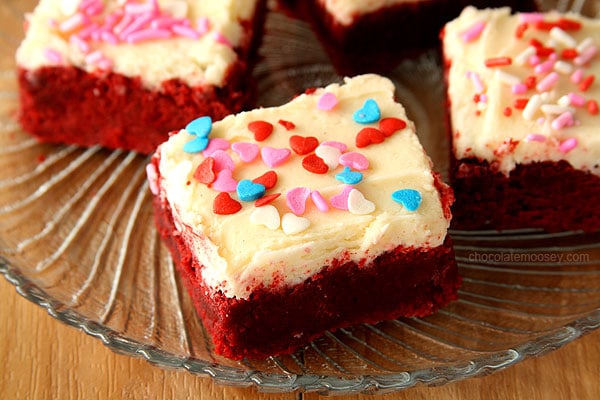 Small Batch Red Velvet Sugar Cookie Bars from scratch without cake mix, complete with a small batch of cream cheese frosting and sprinkles.