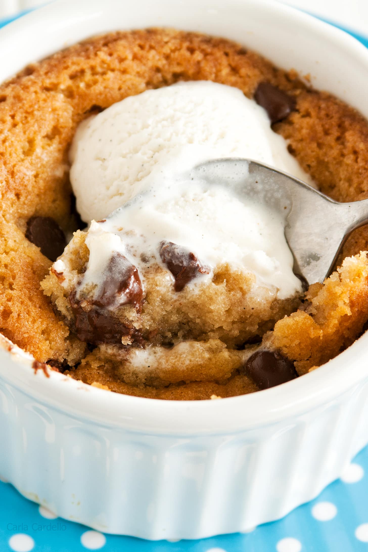 Spoon inside single serve chocolate chip cookie with ice cream