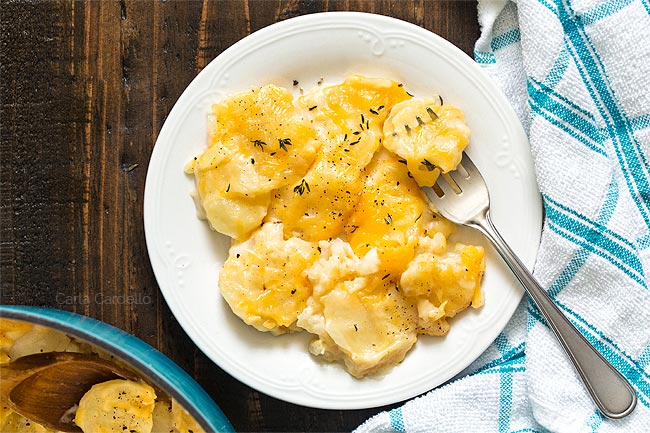 scalloped potatoes on white plate