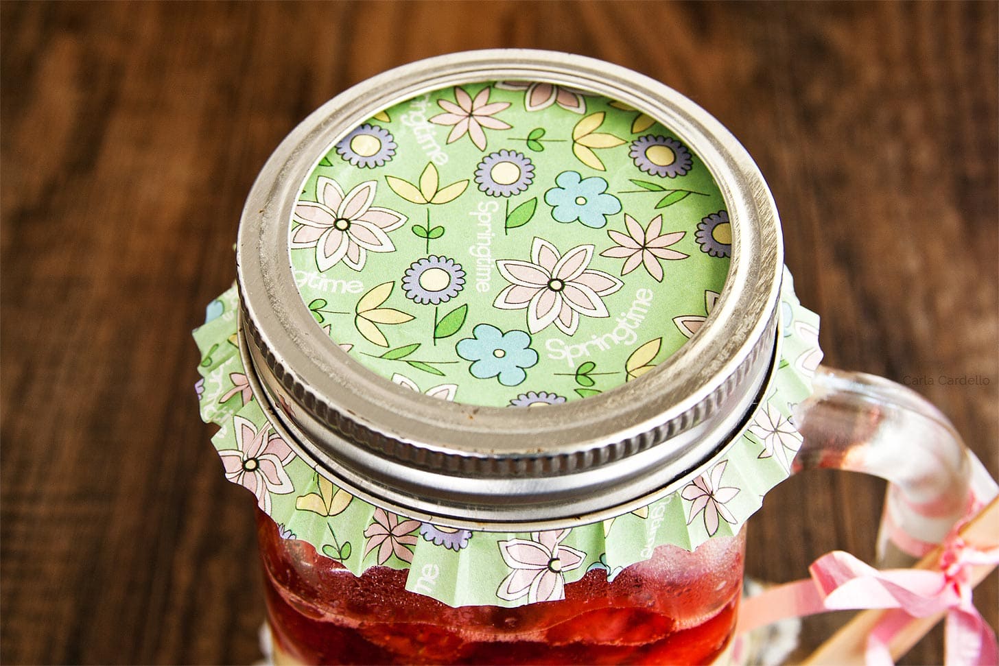 Cupcake liner on top of mason jar cheesecake for a cute gift