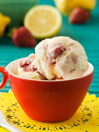 Lemon ice cream with strawberry in red cup