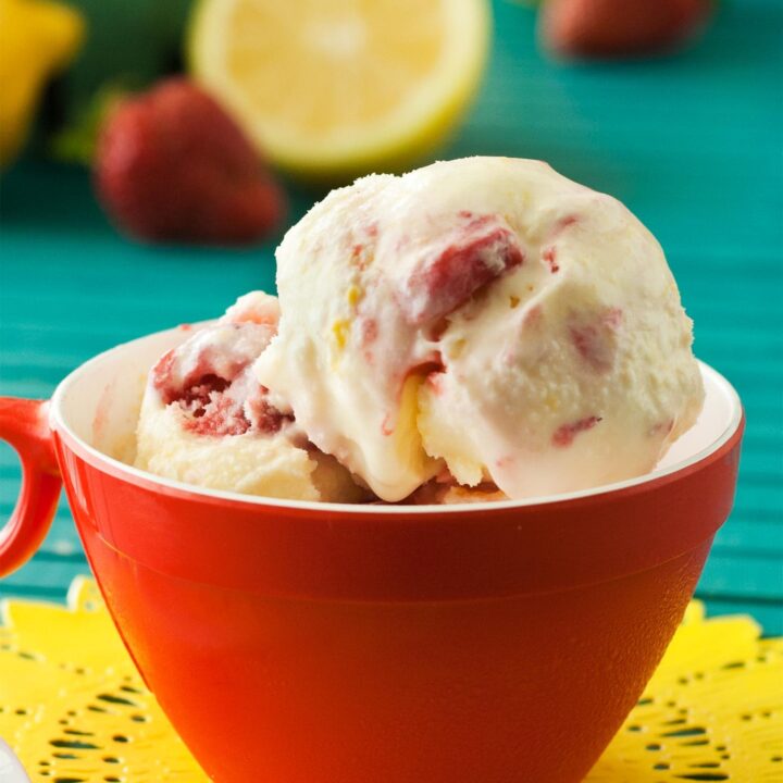 Lemon ice cream with strawberry in red cup