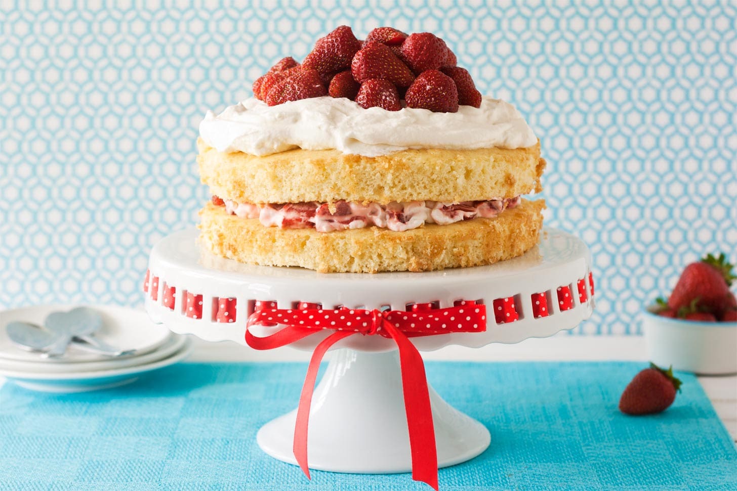 Strawberry Shortcake Cake served on cake stand