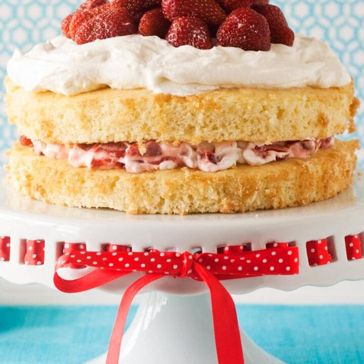 Strawberry Shortcake Cake with sponge cake, whipped cream, and berries