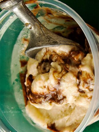 Banana Fudge Ice Cream in bowl with ice cream scoop