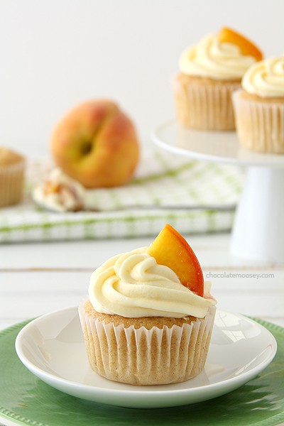 Peaches and Cream Stuffed Cupcakes | www.chocolatemoosey.com