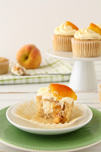 Peaches and Cream Stuffed Cupcakes | www.chocolatemoosey.com