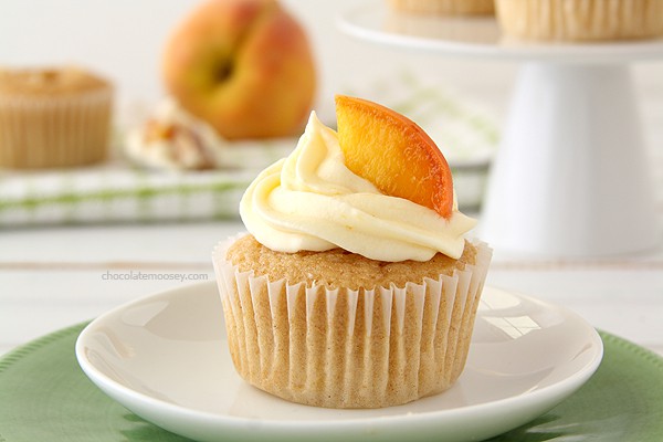 Peaches and Cream Stuffed Cupcakes | www.chocolatemoosey.com