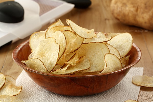 Close up of homemade potato chips in a brown bowl