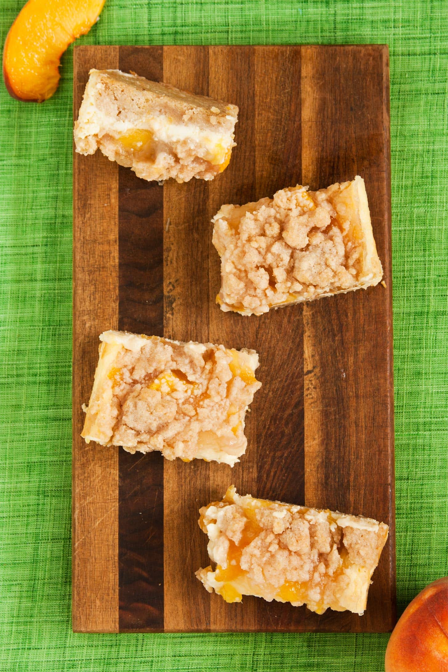 Peach Crumb Bars on wooden cutting board