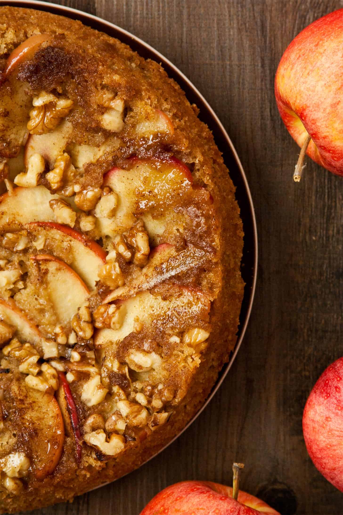 Close up of apple upside down cake with caramelized apple and crunchy walnuts