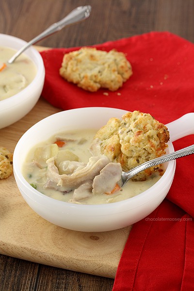 Craving chicken pot pie but don't have time to make it? This Chicken Pot Pie Soup For Two recipe with cheddar biscuits has all of your favorite ingredients in one bite without having to make a pie crust. 