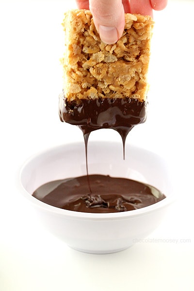 Dipping Small Batch Peanut Butter Rice Krispie Treats in chocolate