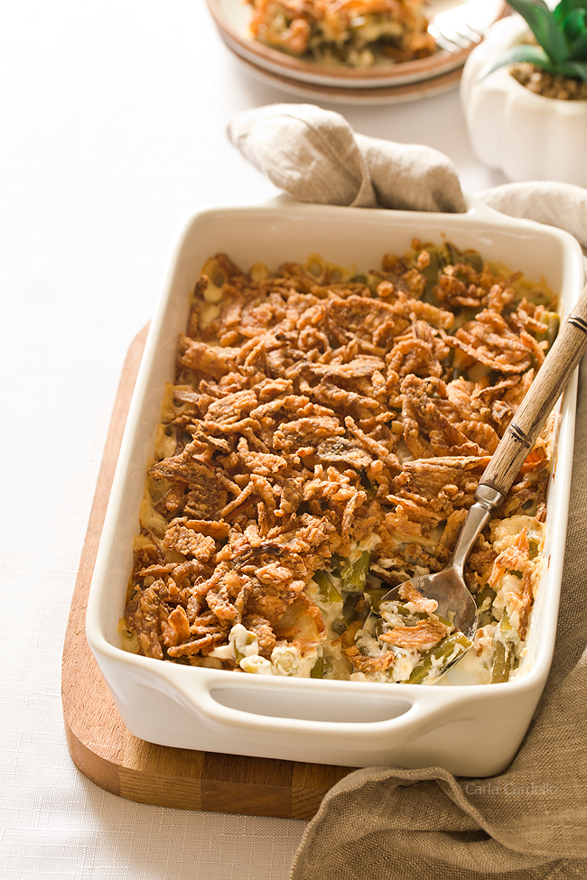 White casserole dish filled with green bean casserole