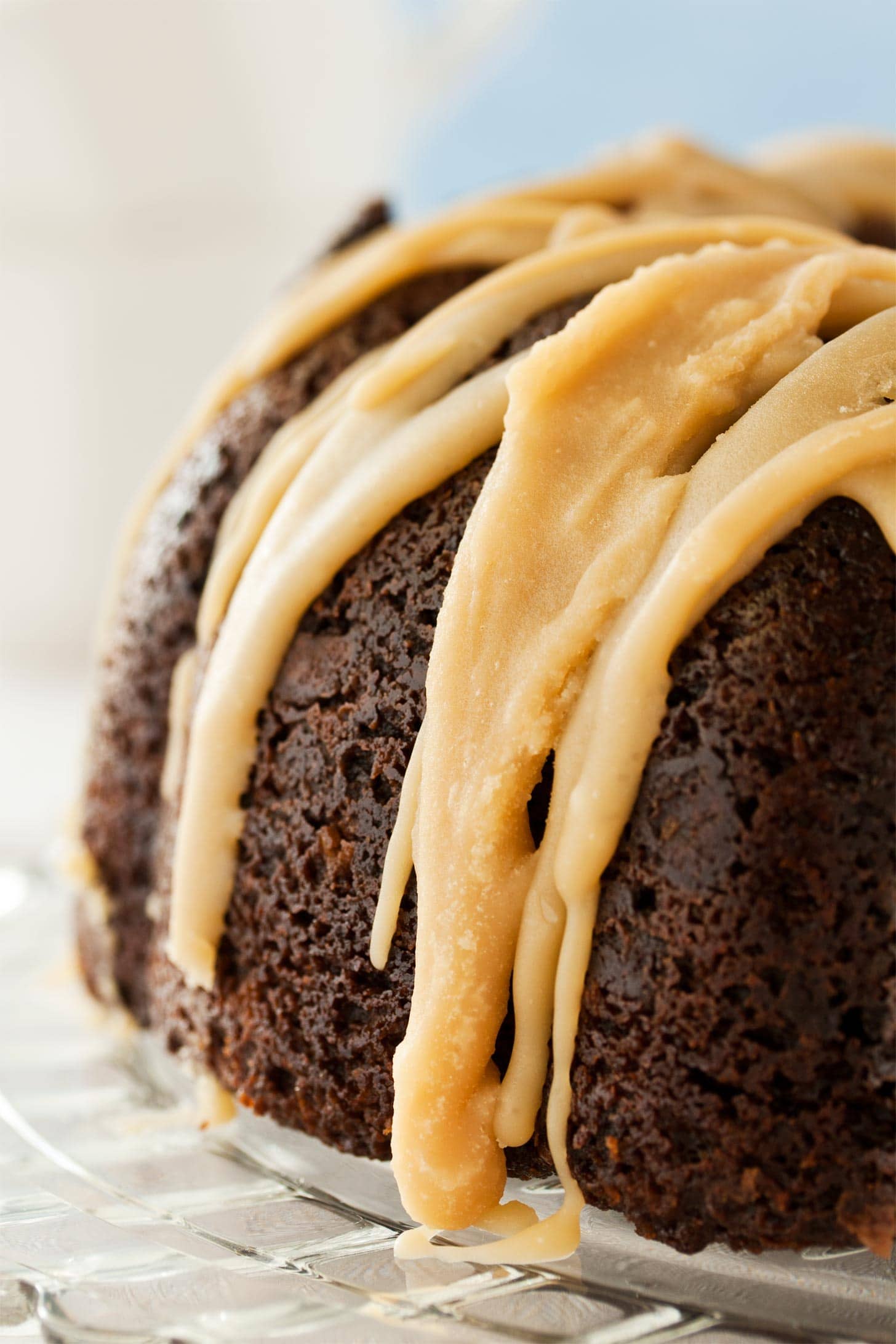 Close up of caramel glaze on chocolate bundt cake