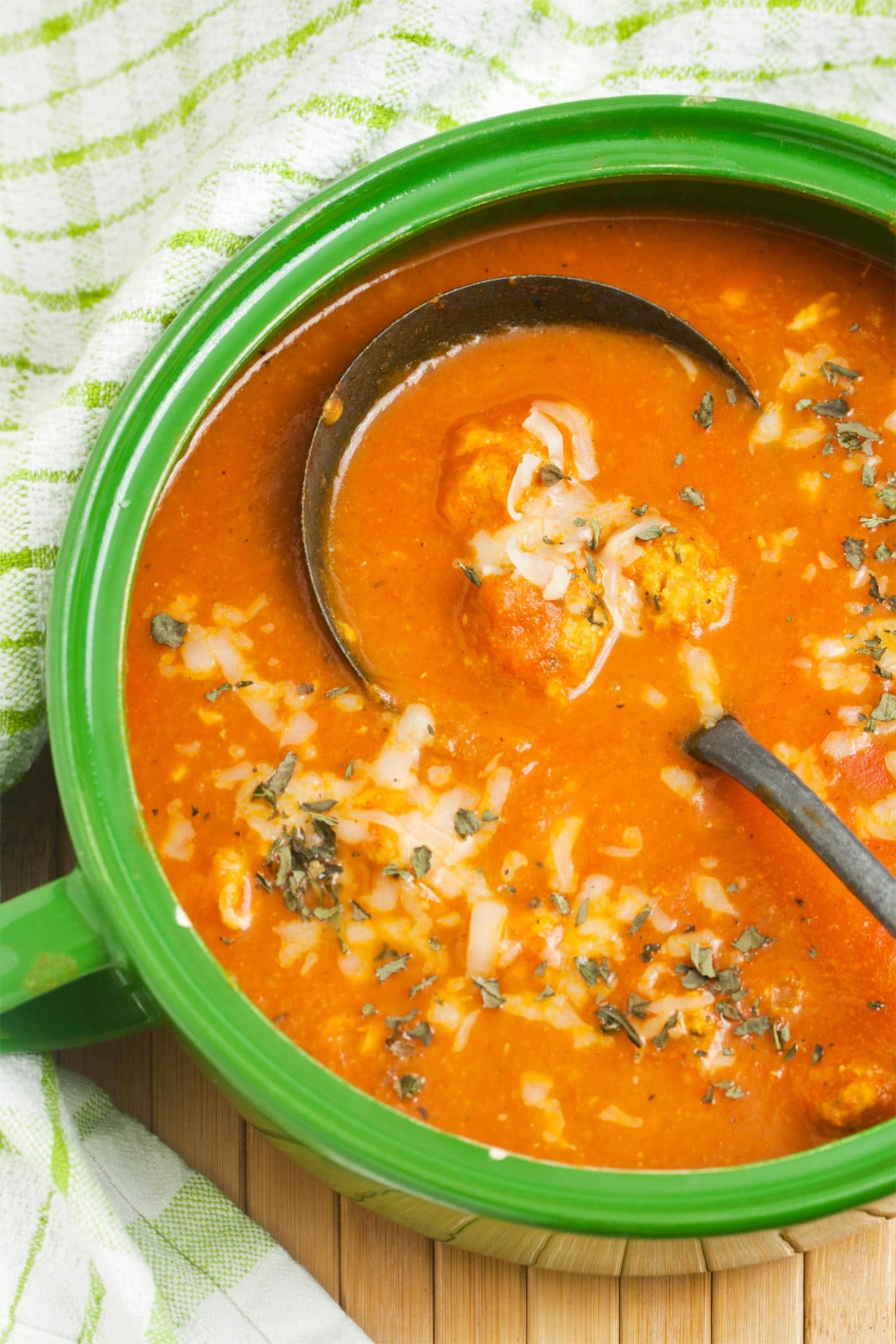 Green Dutch oven filled with chicken parmesan soup