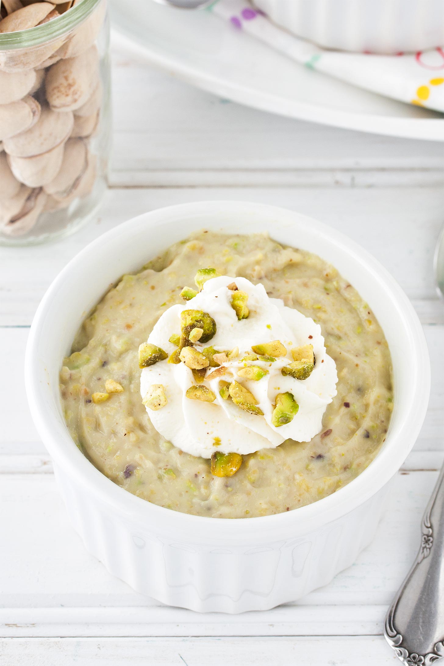 Homemade pistachio pudding in white ramekin