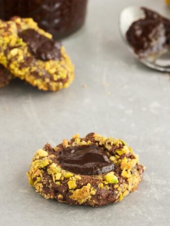 Chocolate thumbprint cookies on parchment paper