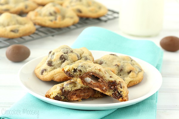 Cadbury Egg Cookies cut in half on a plate