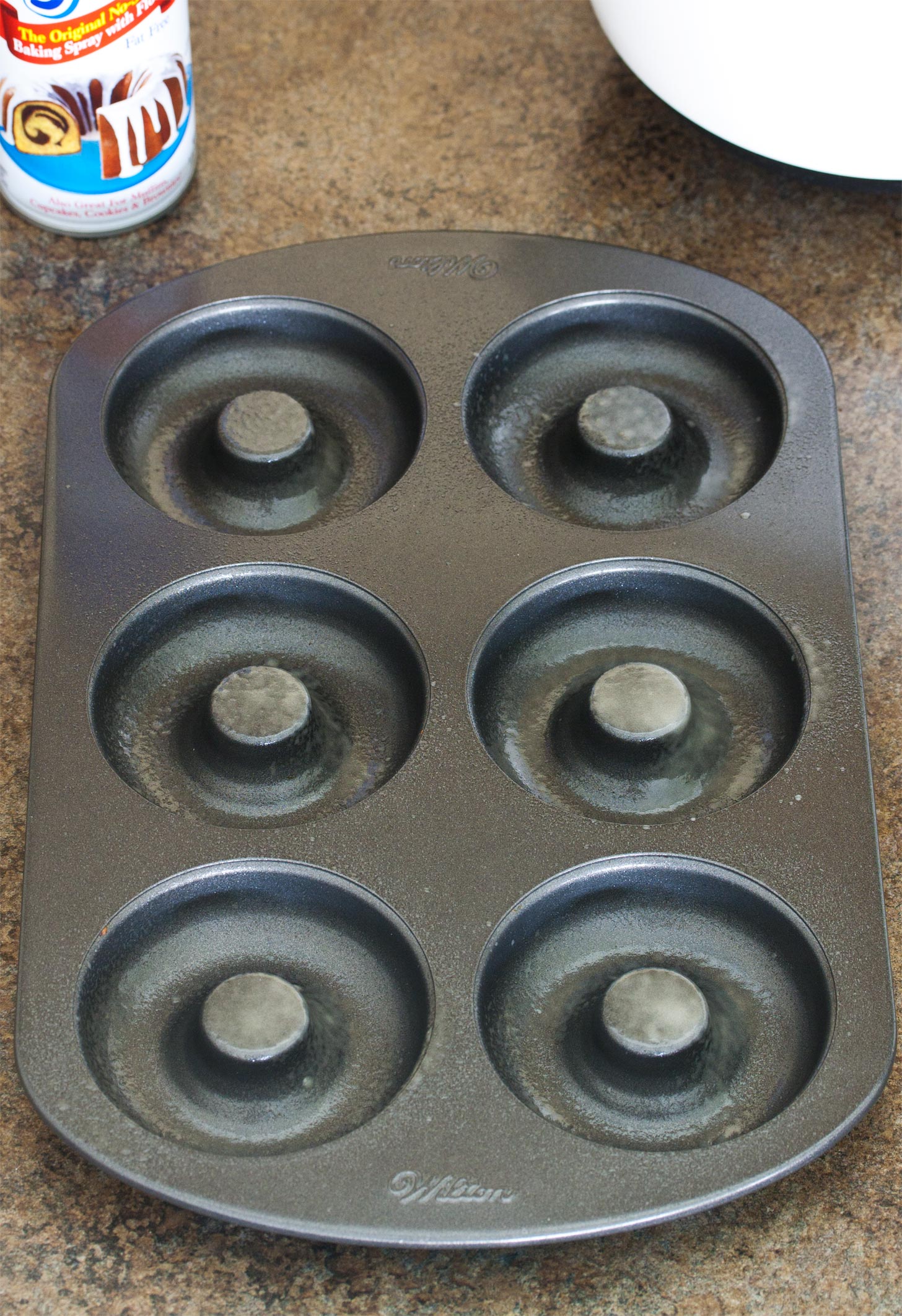 Donut pan greased for baked doughnut recipe