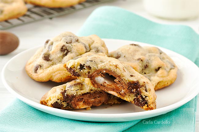 Cadbury egg cookies cut in half on a white plate