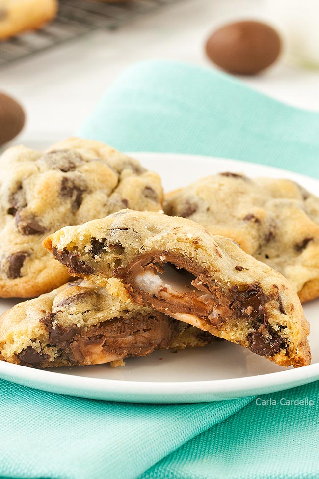 Cadbury egg cookies cut in half on a white plate