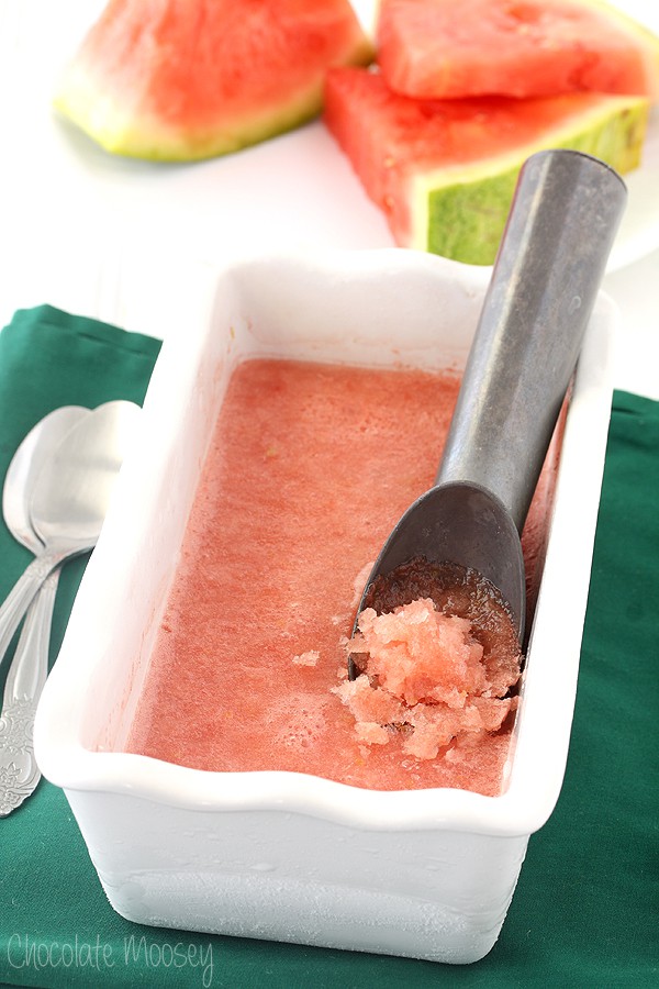 Watermelon Italian Ice in a white pan with scoop