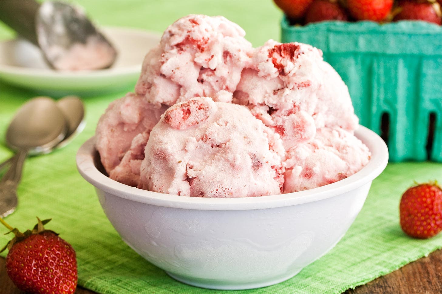 Homemade strawberry ice cream in a white bowl